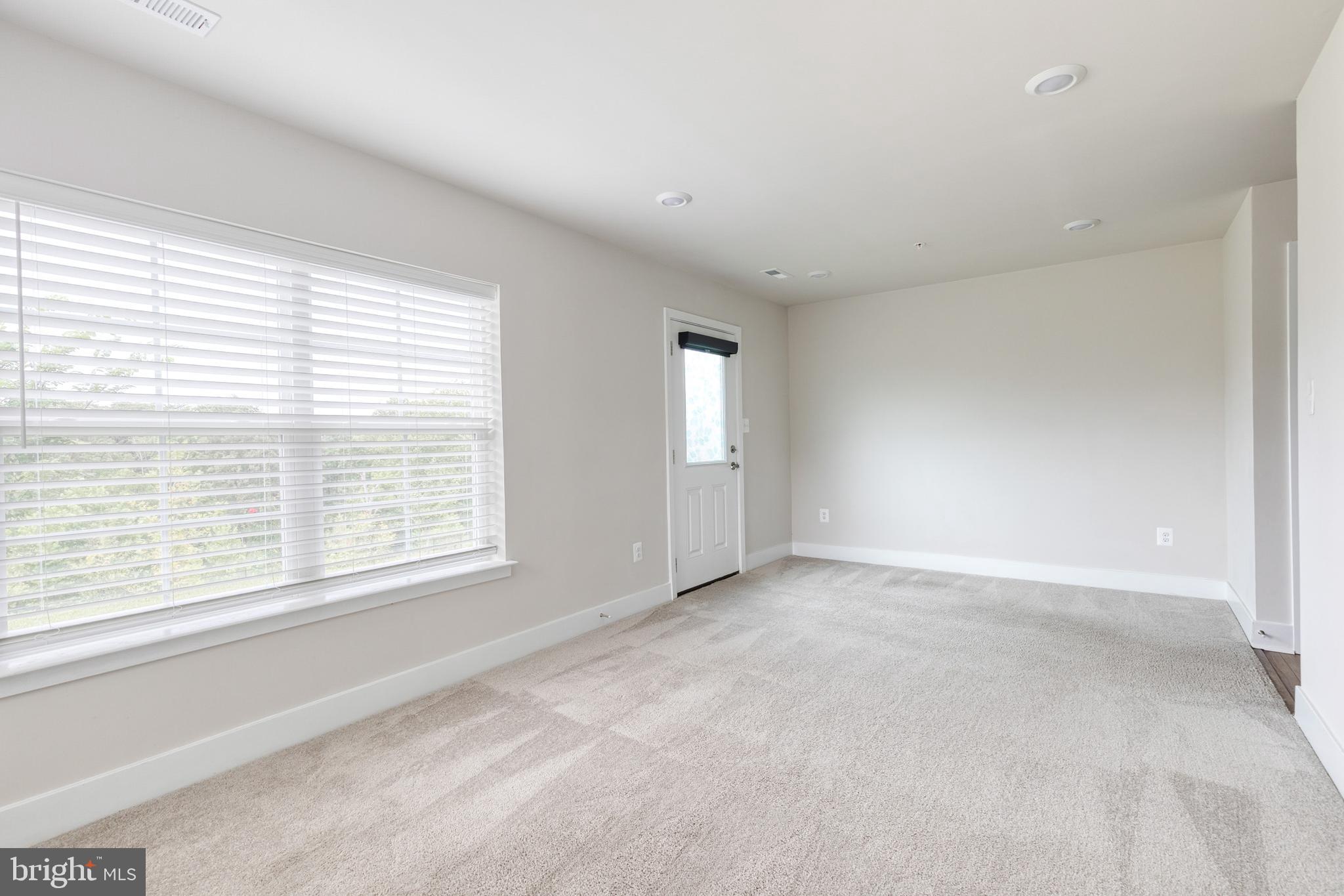 2008 Ivory Brook Road Baltimore, MD 21244 - Photo 6 of 35 a view of an empty room with a window