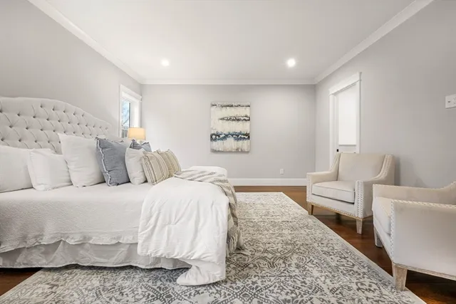 a bedroom with a large bed and a couch