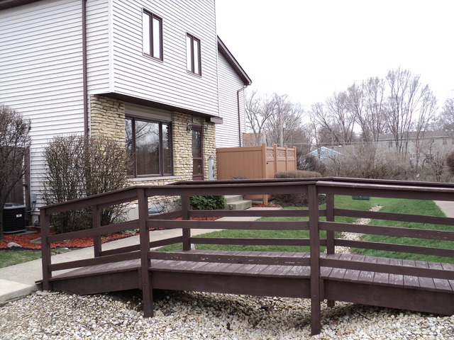 623 Northgate Road, Unit 623 New Lenox, IL 60451 - Photo 2 of 9 a front view of a house with a yard