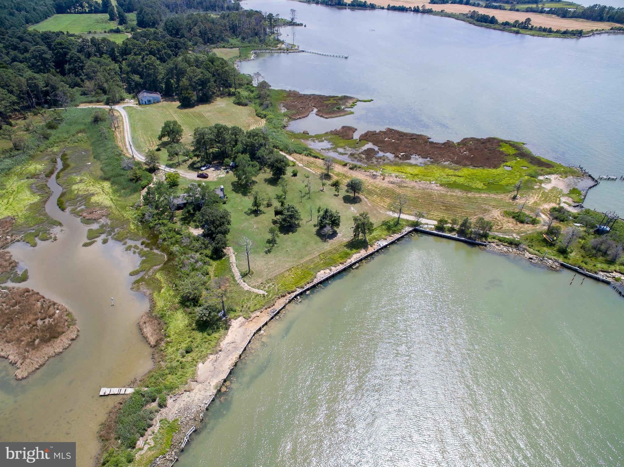 Hoopers Neck Road Taylors Island, MD 21669 - Photo 22 of 28 a view of a lake with a mountain