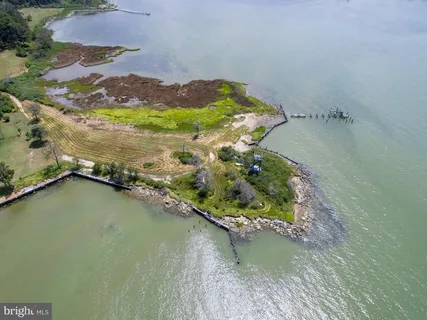 an aerial view of ocean with residential house with outdoor space