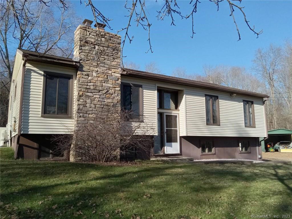 1089 Windham Road Windham, CT 06266 - Photo 1 of 1 a front view of a house with a garden