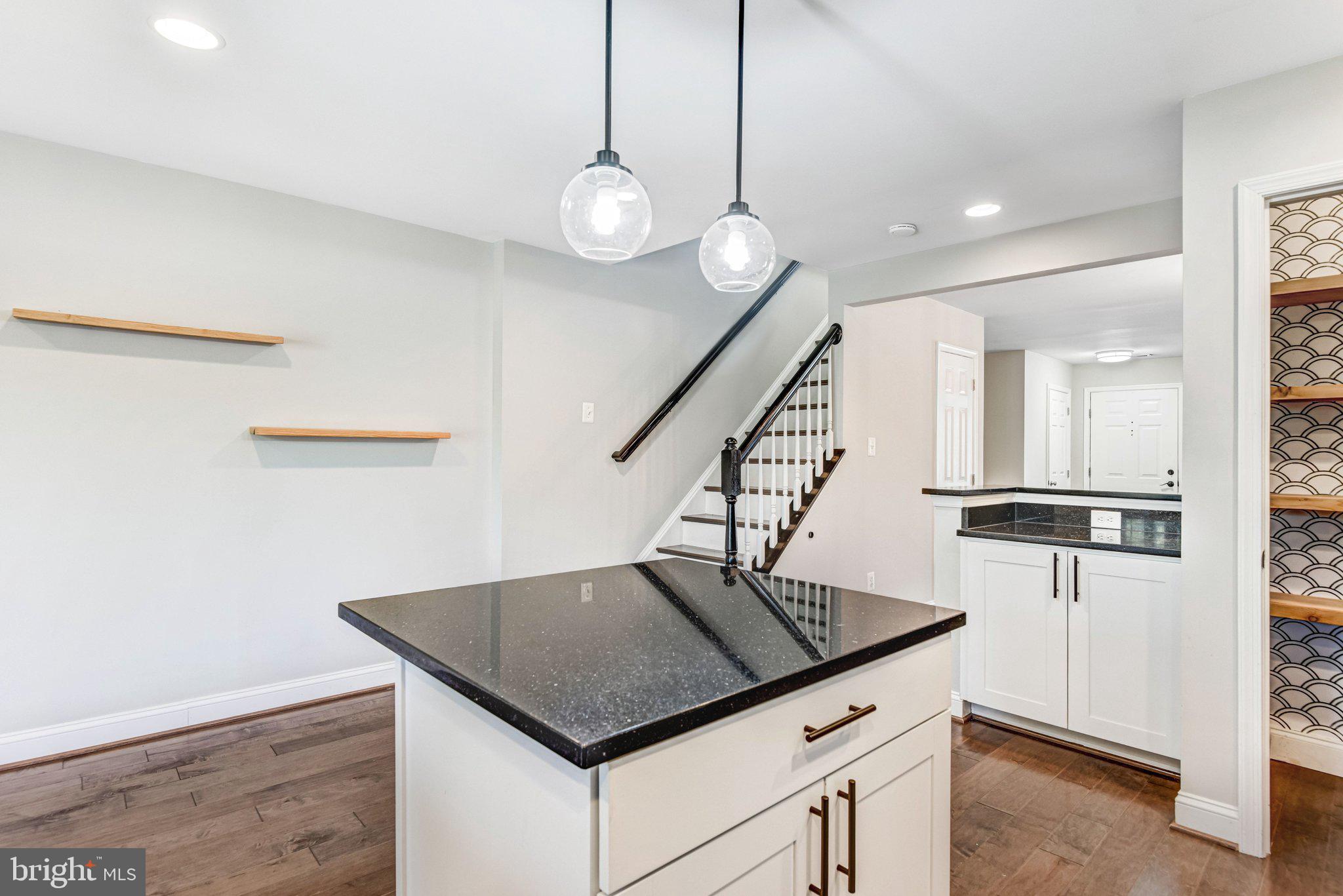22142 Trailside Square Sterling, VA 20164 - Photo 11 of 32 a kitchen with stainless steel appliances granite countertop a refrigerator a sink and a stove