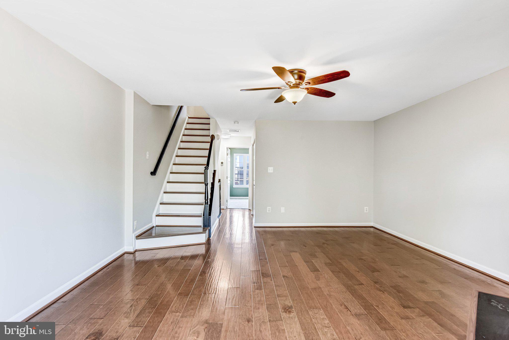 22142 Trailside Square Sterling, VA 20164 - Photo 14 of 32 wooden floor in an empty room with a window
