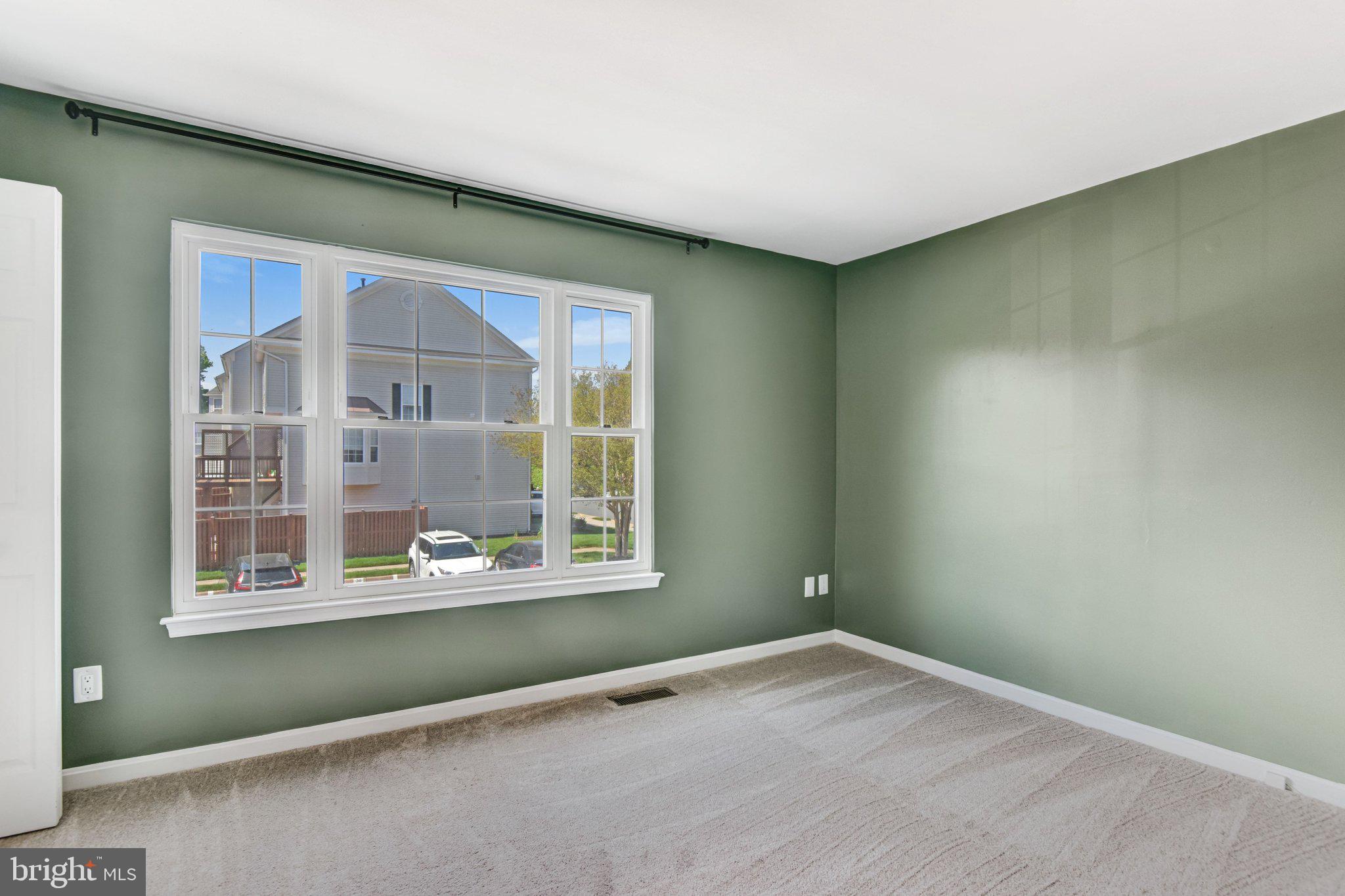 22142 Trailside Square Sterling, VA 20164 - Photo 16 of 32 an empty room with windows