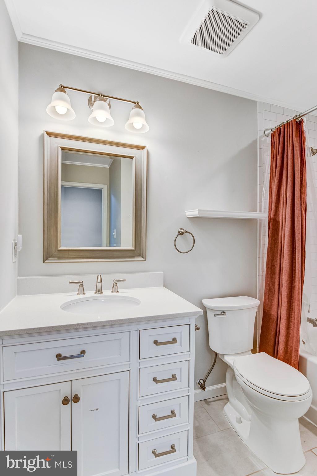 22142 Trailside Square Sterling, VA 20164 - Photo 19 of 32 a bathroom with a toilet sink and mirror