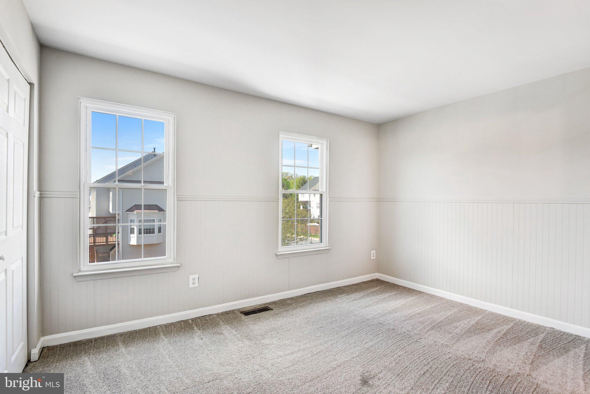 22142 Trailside Square Sterling, VA 20164 - Photo 20 of 32 an empty room with windows