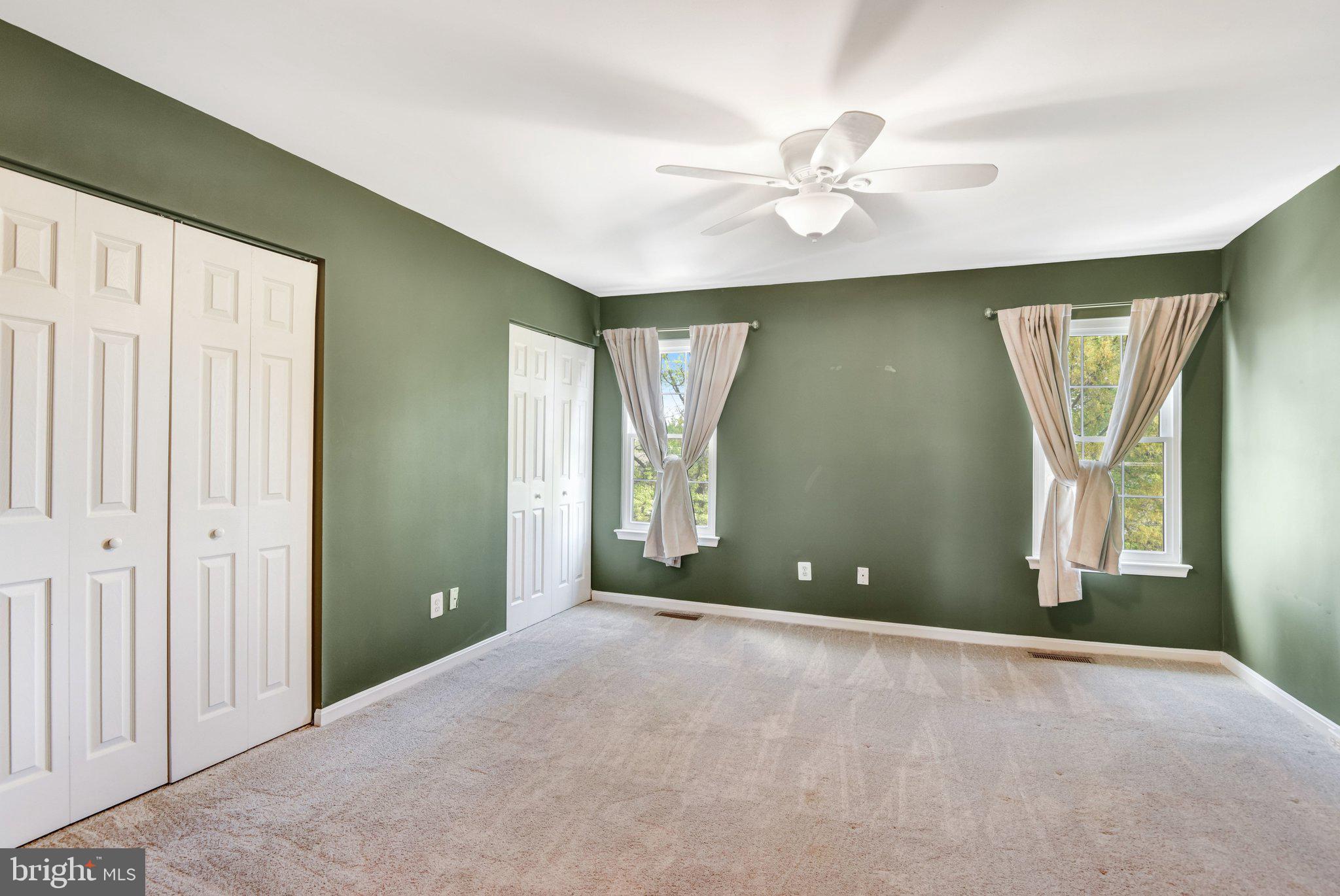 22142 Trailside Square Sterling, VA 20164 - Photo 22 of 32 a view of a livingroom with a chandelier fan and windows