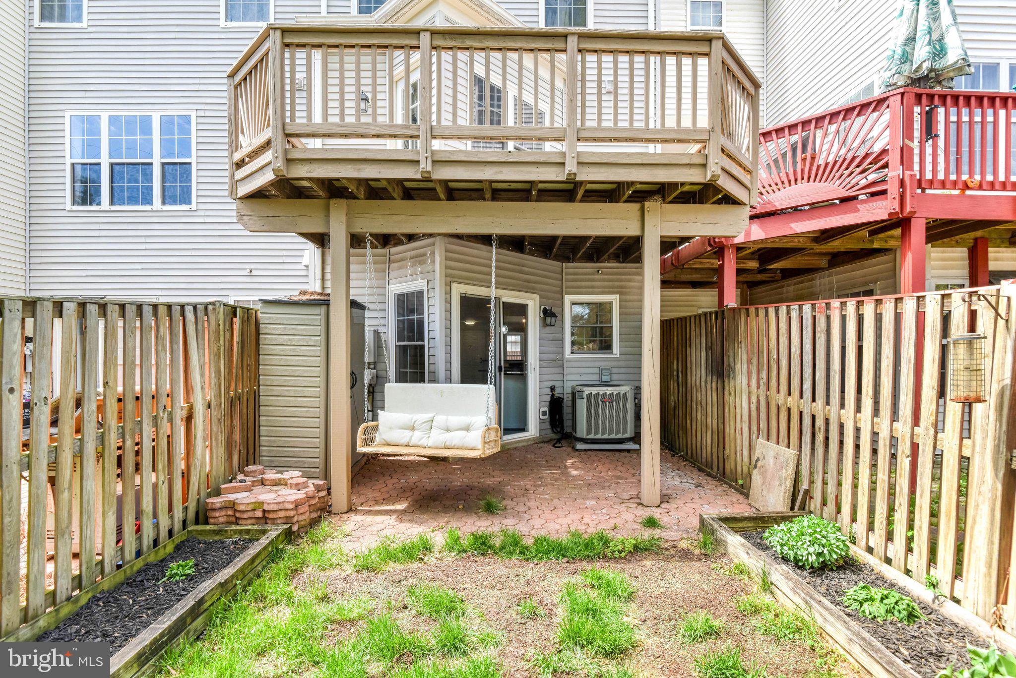 22142 Trailside Square Sterling, VA 20164 - Photo 27 of 32 a view of a house with a yard and sitting area