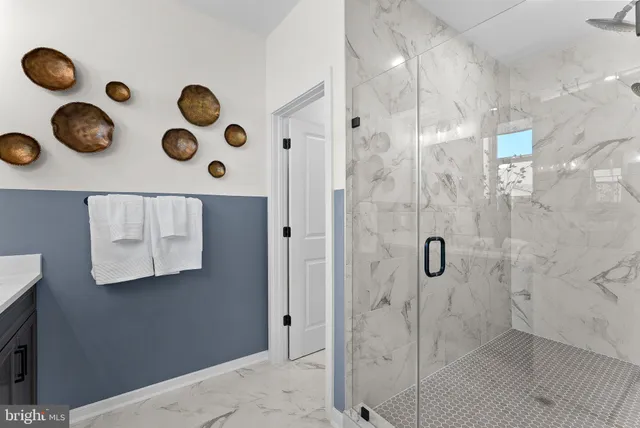 a bathroom with a tub and shower