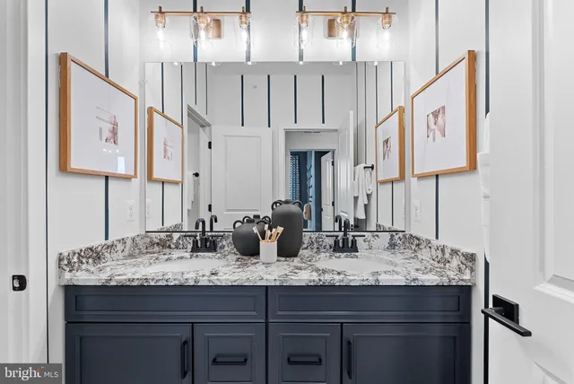 a bathroom with sinks a mirror and a sink