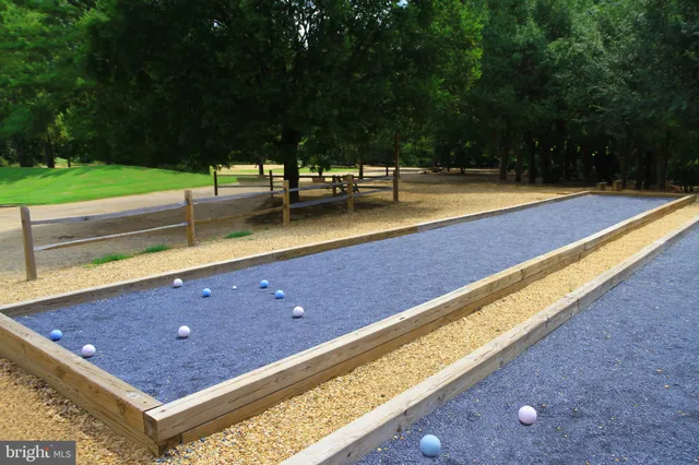 a view of a tennis court with a bench