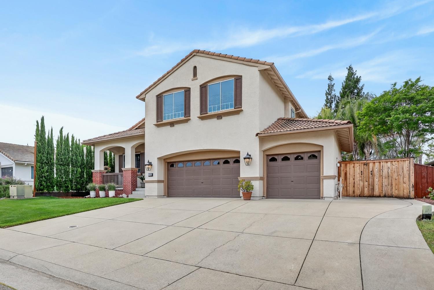 1203 Halidon Way Folsom, CA 95630 - Photo 1 of 98 a front view of a house with a yard and garage