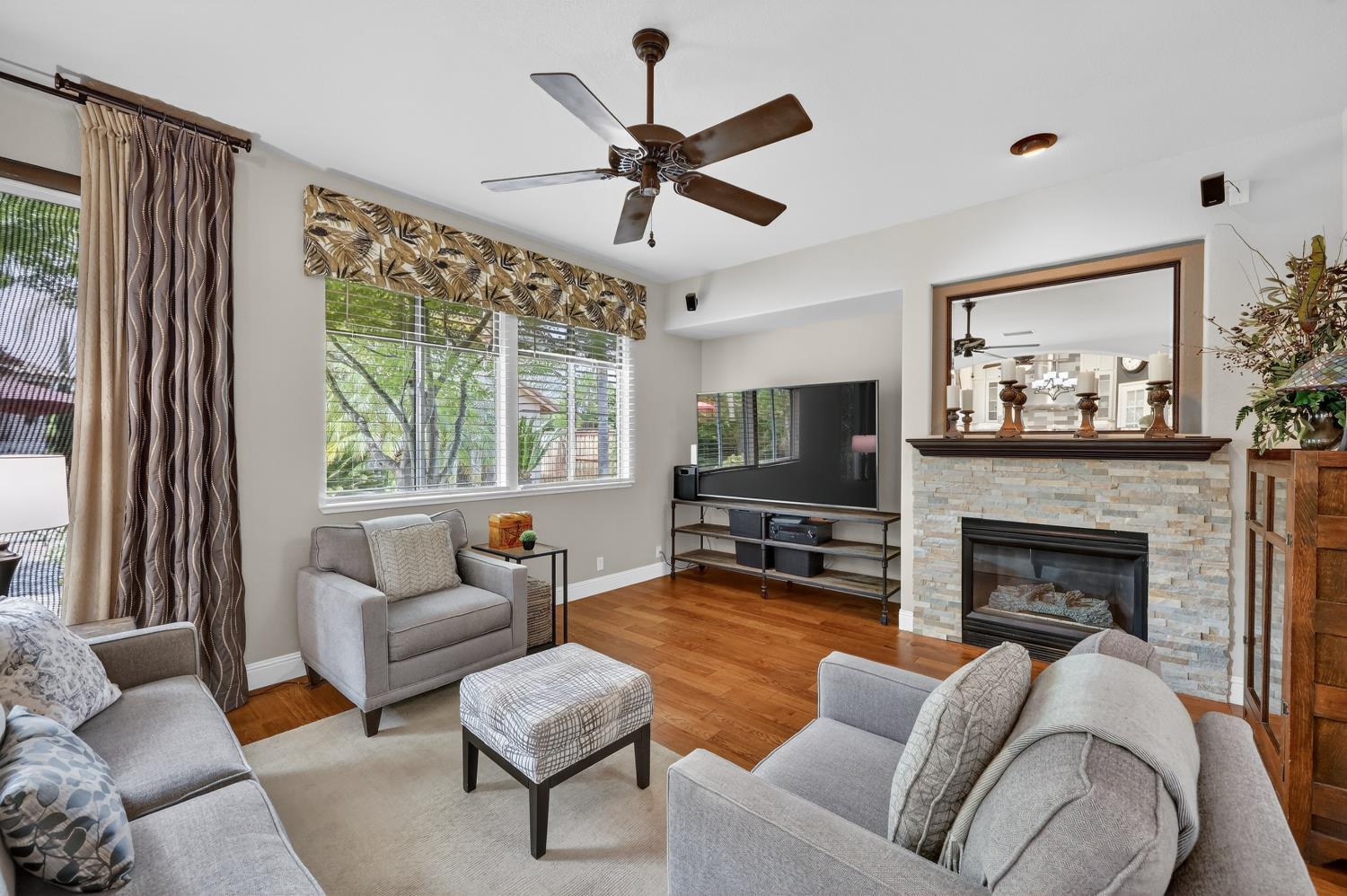 1203 Halidon Way Folsom, CA 95630 - Photo 25 of 98 a living room with furniture fireplace and a large window
