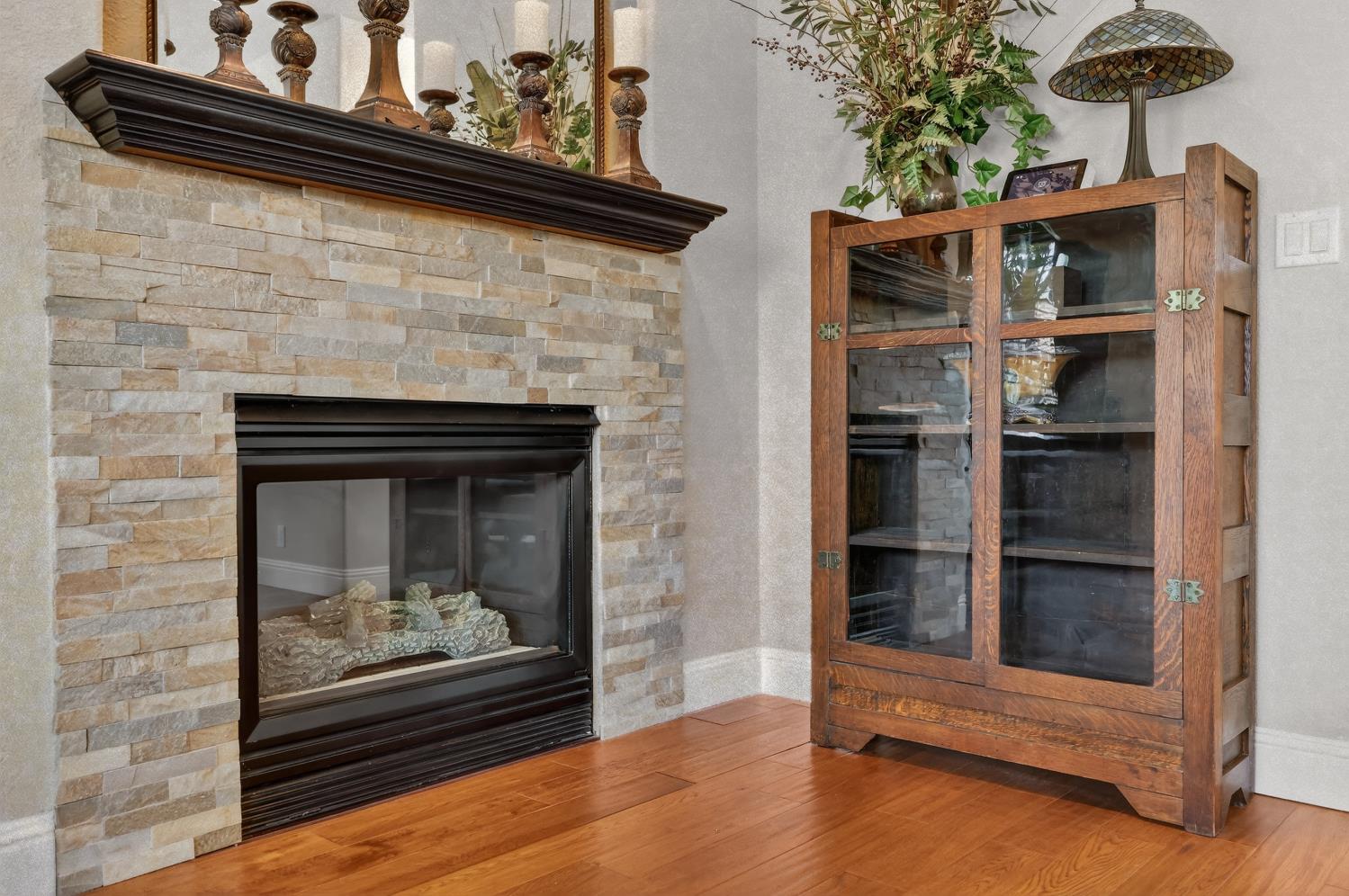 1203 Halidon Way Folsom, CA 95630 - Photo 29 of 98 a room with fireplace and wooden floor