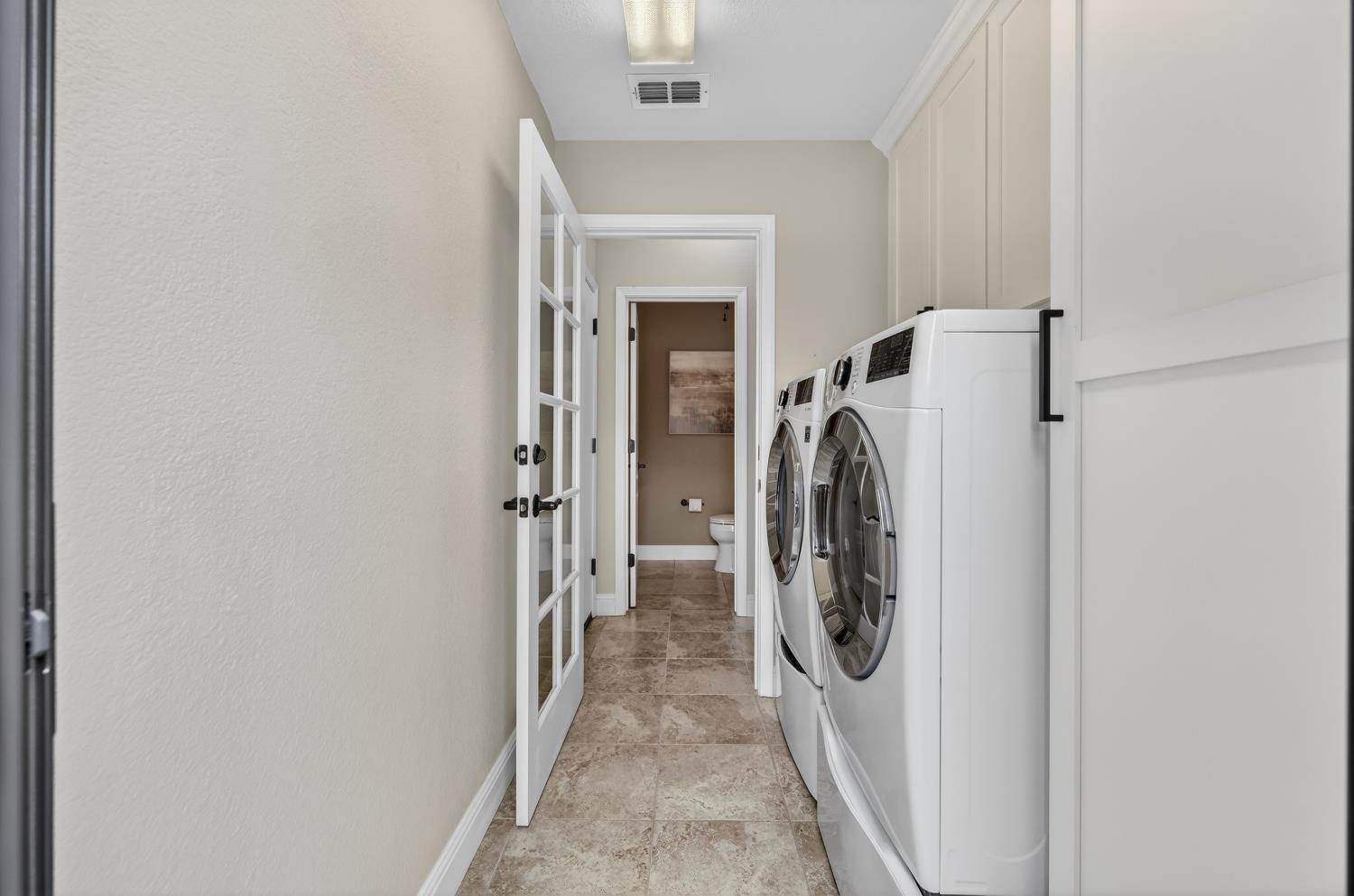 1203 Halidon Way Folsom, CA 95630 - Photo 33 of 98 a view of a storage & utility room with a washer dryer