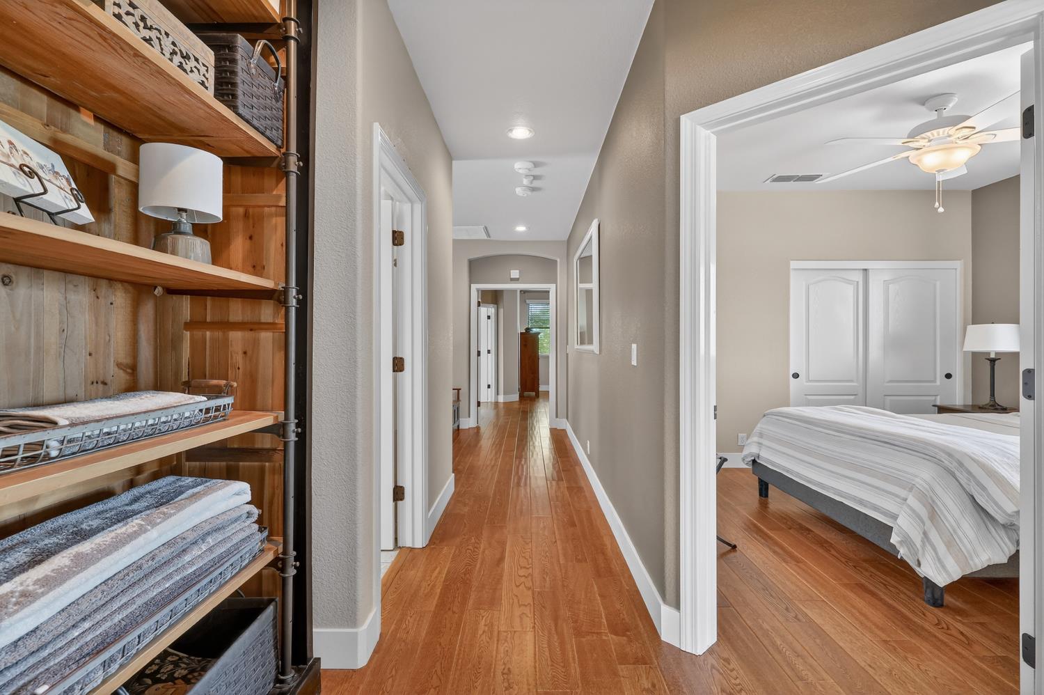 1203 Halidon Way Folsom, CA 95630 - Photo 37 of 98 a view of a hallway with wooden floor and staircase