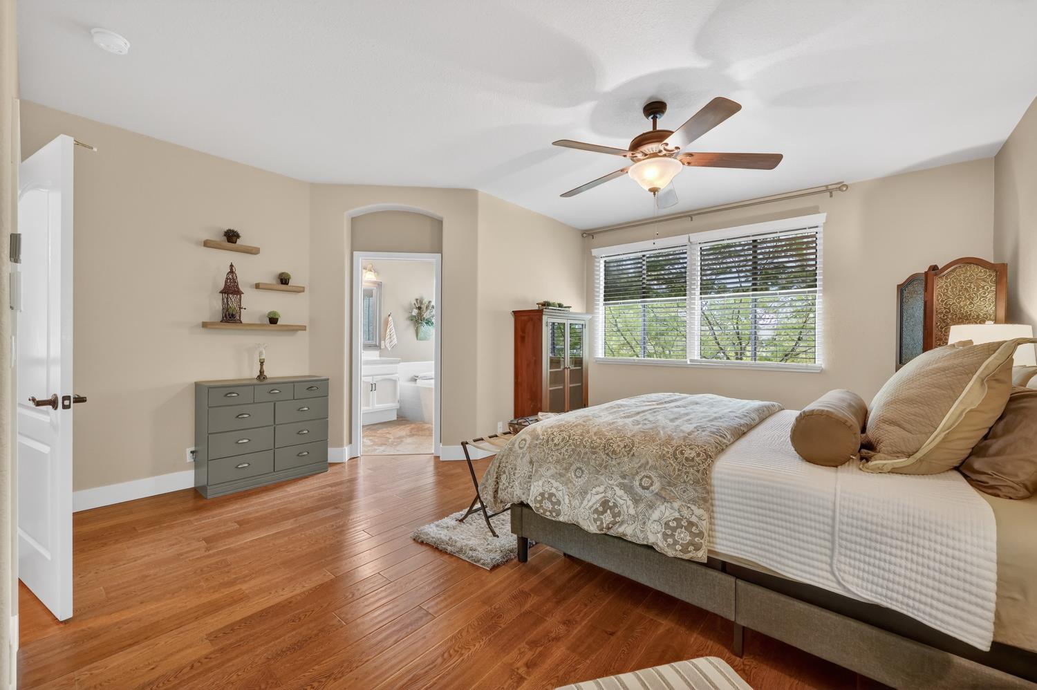 1203 Halidon Way Folsom, CA 95630 - Photo 40 of 98 a bedroom with a bed and a large window with wooden floor