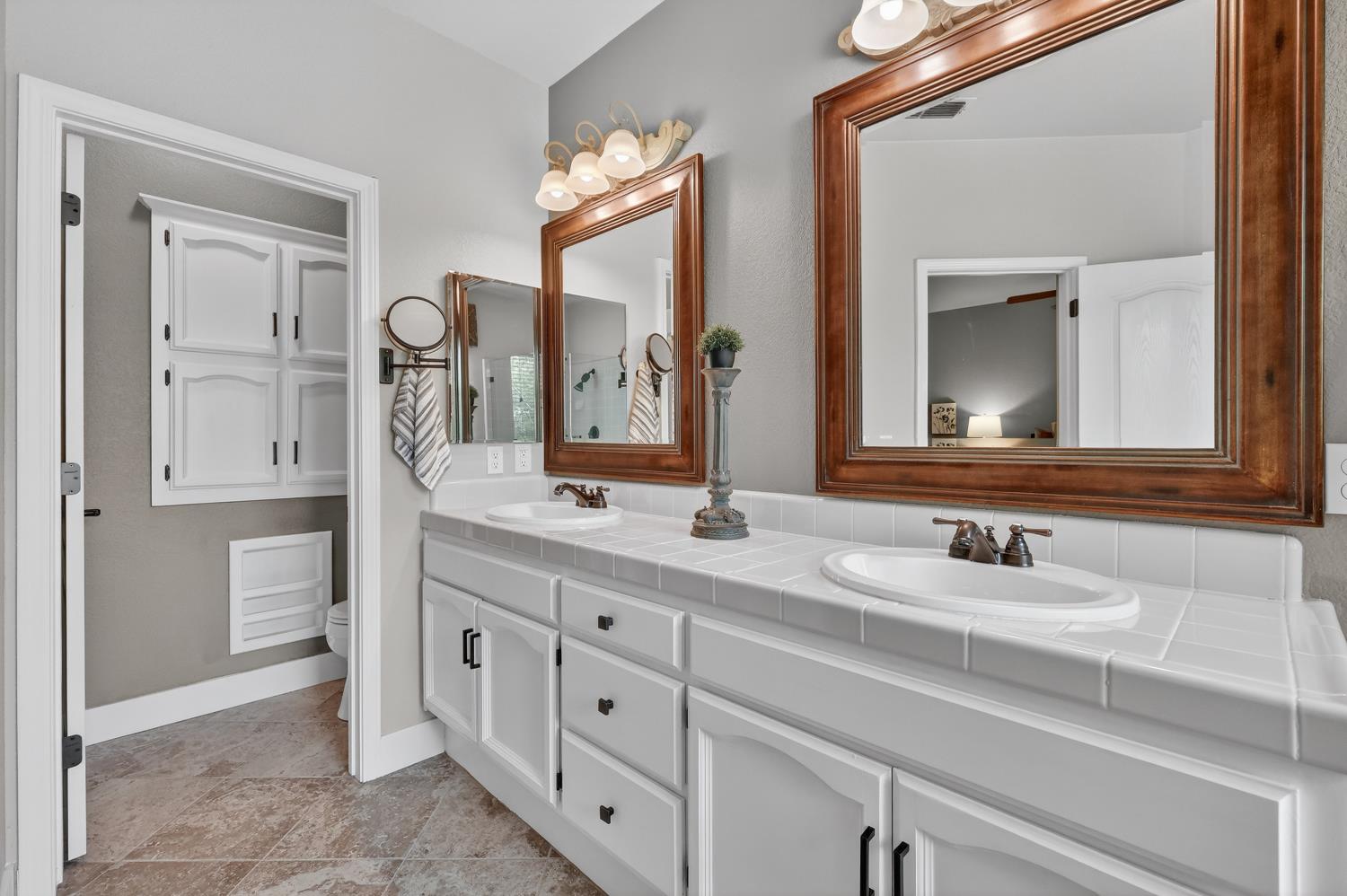 1203 Halidon Way Folsom, CA 95630 - Photo 43 of 98 a bathroom with a double vanity sink and a mirror