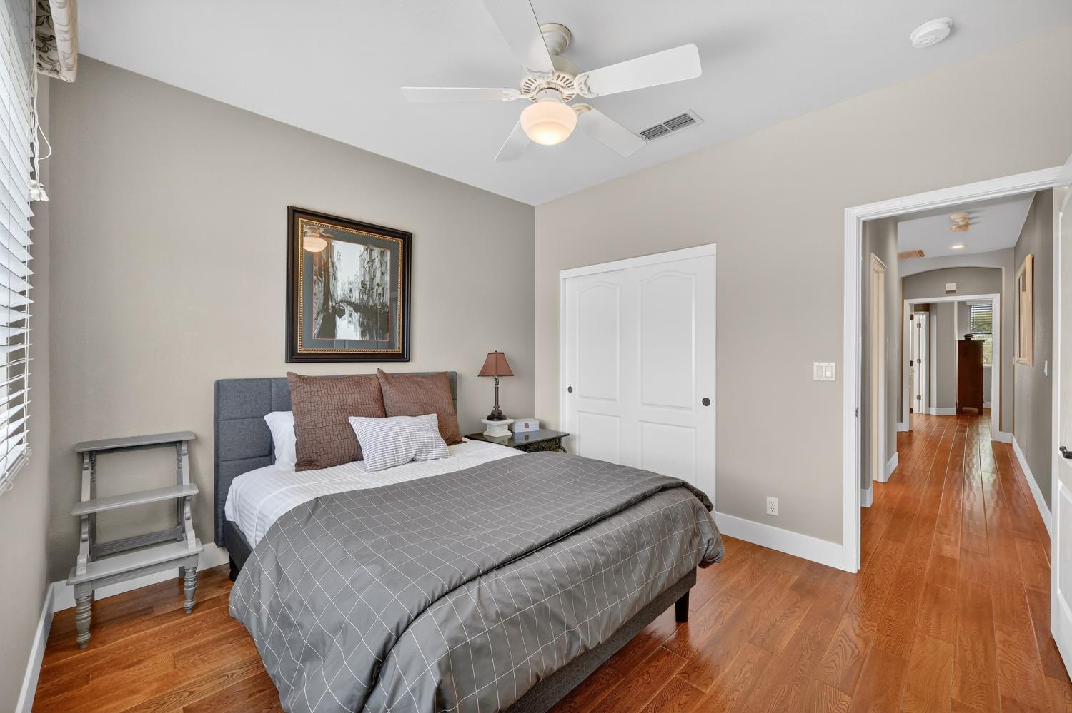 1203 Halidon Way Folsom, CA 95630 - Photo 47 of 98 a bedroom with a bed and a chandelier