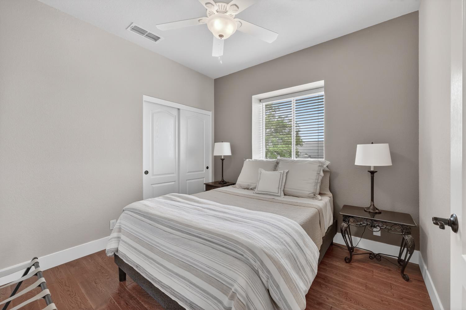 1203 Halidon Way Folsom, CA 95630 - Photo 48 of 98 a bedroom with a bed and a table lamp