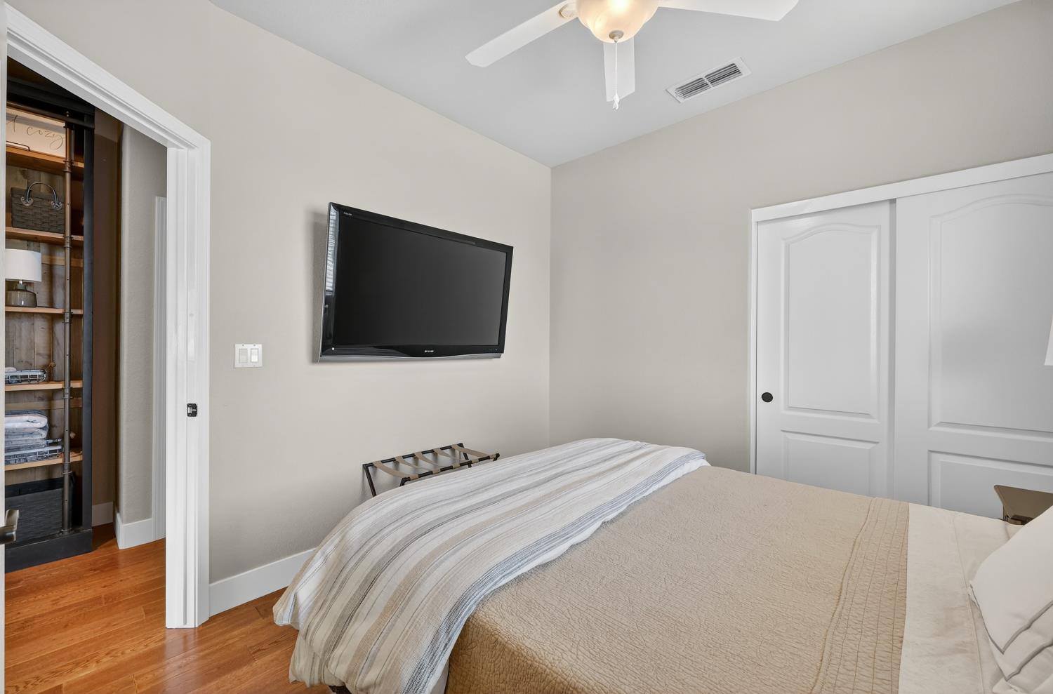 1203 Halidon Way Folsom, CA 95630 - Photo 49 of 98 a bedroom with a bed and a flat screen tv