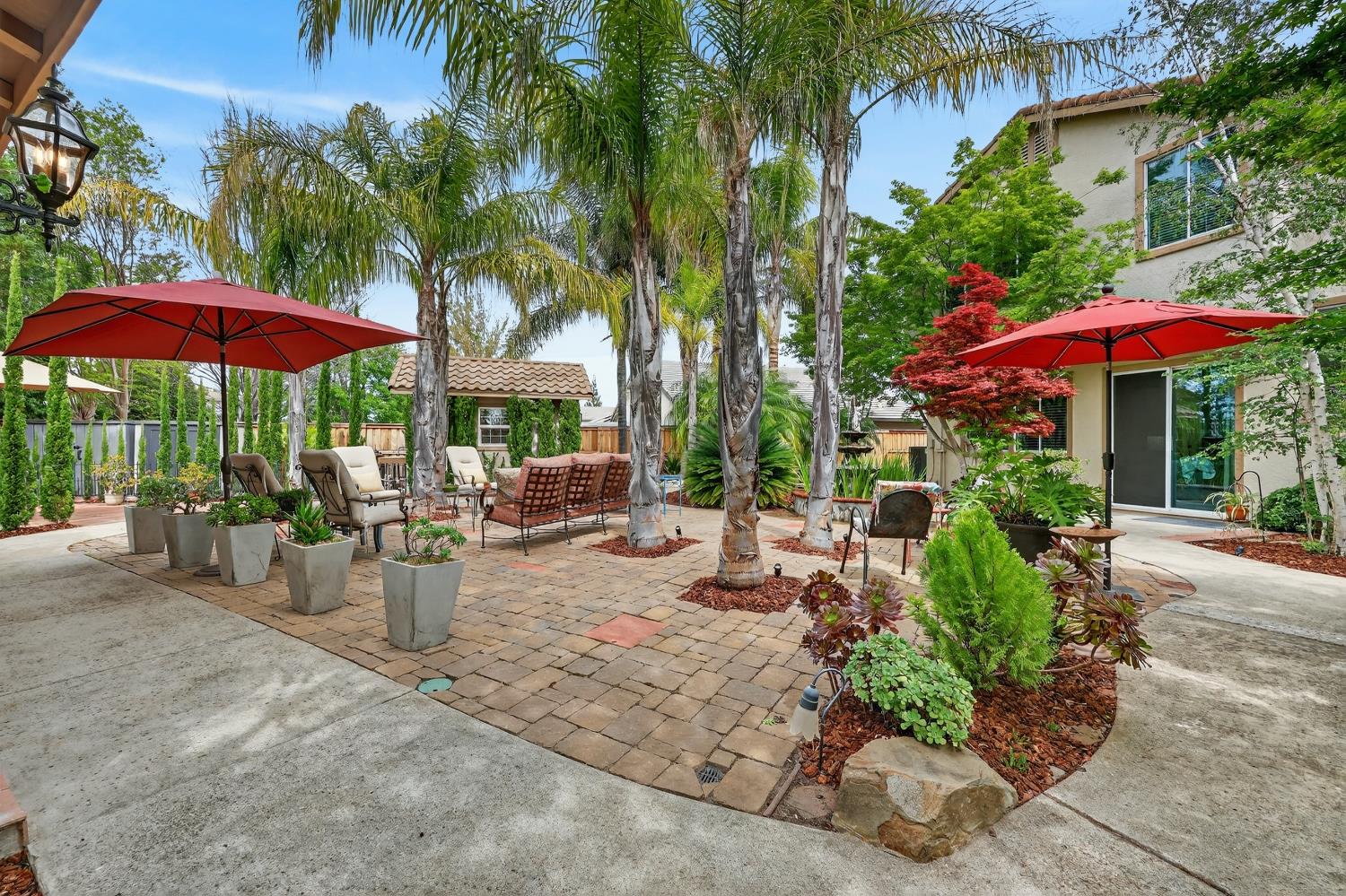 1203 Halidon Way Folsom, CA 95630 - Photo 58 of 98 a view of a patio with chairs and table under an umbrella