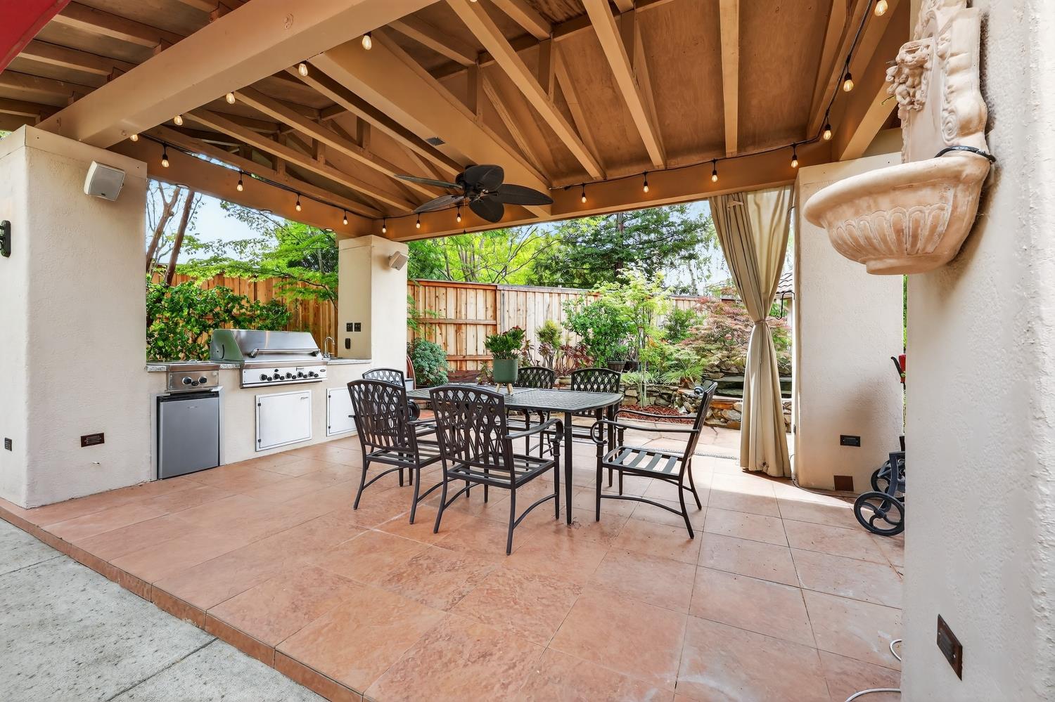 1203 Halidon Way Folsom, CA 95630 - Photo 63 of 98 a view of a patio with table and chairs potted plants with floor to ceiling window