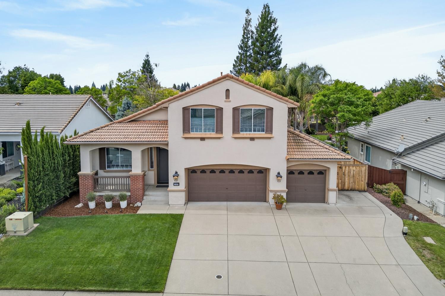 1203 Halidon Way Folsom, CA 95630 - Photo 88 of 98 a front view of a house with a garden