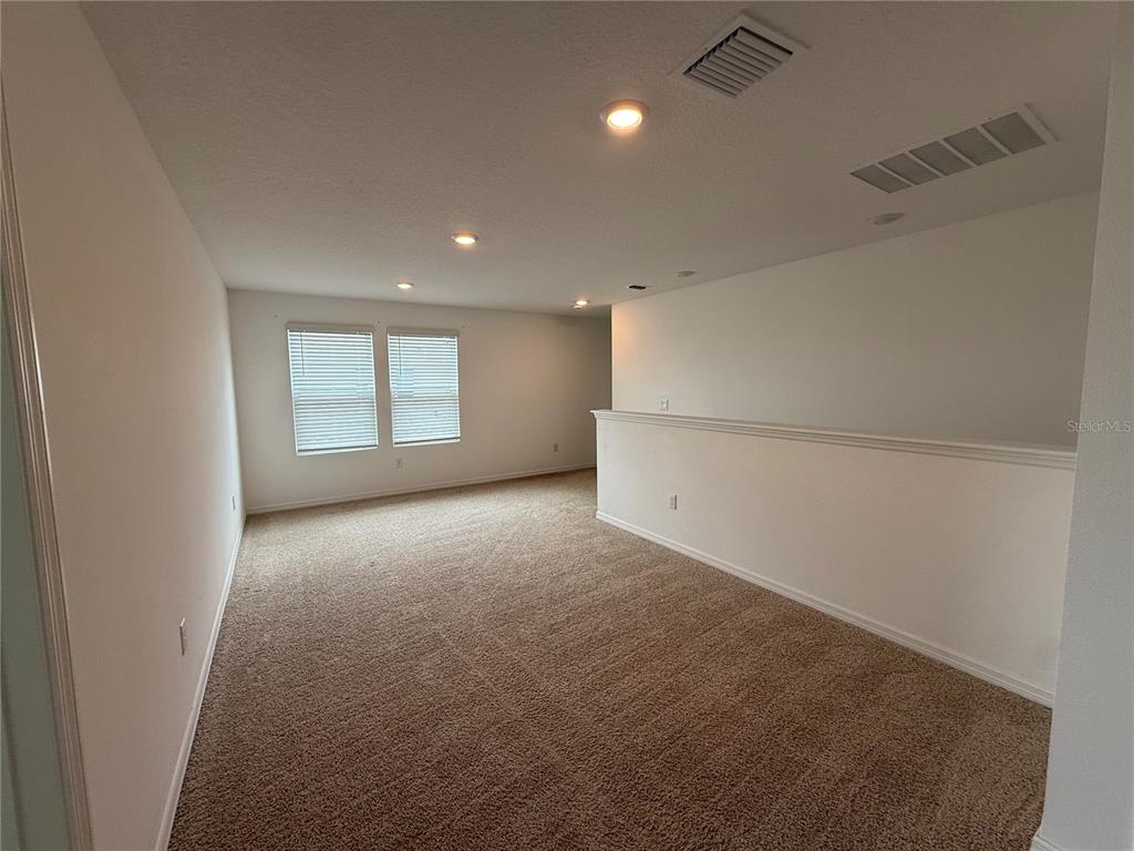 6431 Milestone Loop Palmetto, FL 34221 - Photo 14 of 28 an empty room with a empty space and windows