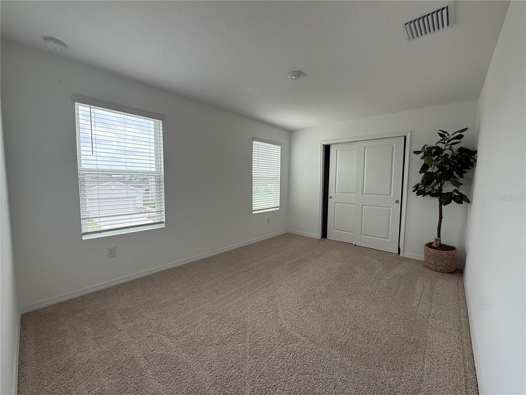 6431 Milestone Loop Palmetto, FL 34221 - Photo 15 of 28 a view of empty room with windows