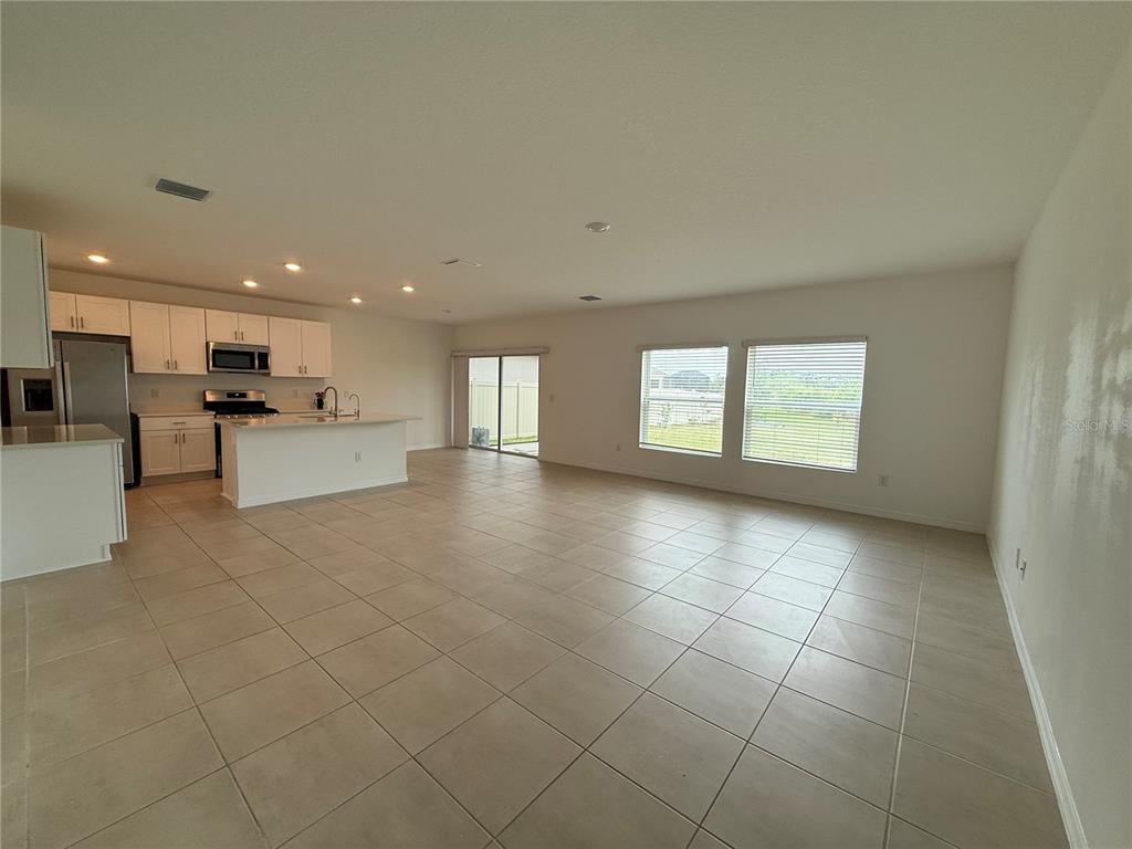 6431 Milestone Loop Palmetto, FL 34221 - Photo 2 of 28 a view of an empty room with a window