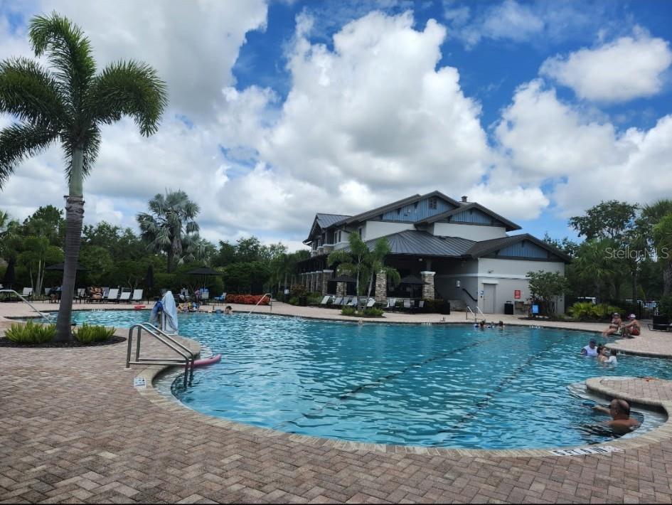 6431 Milestone Loop Palmetto, FL 34221 - Photo 27 of 28 a view of a house with swimming pool and sitting area
