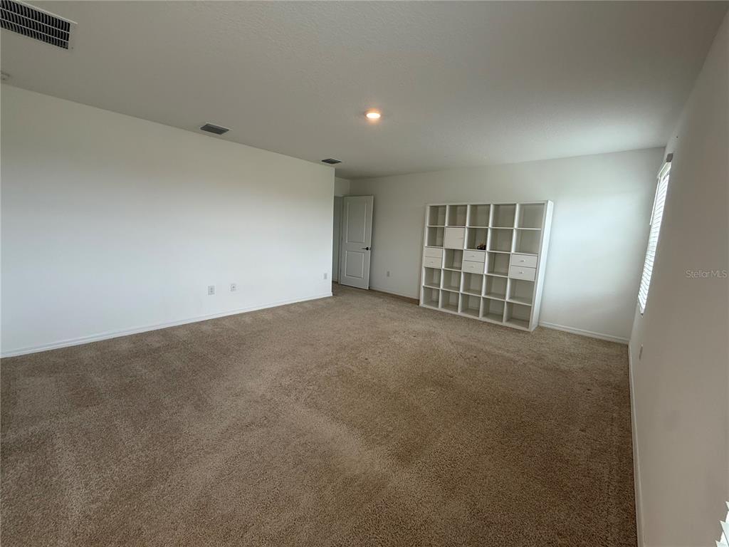 6431 Milestone Loop Palmetto, FL 34221 - Photo 9 of 28 a view of an empty room with a window
