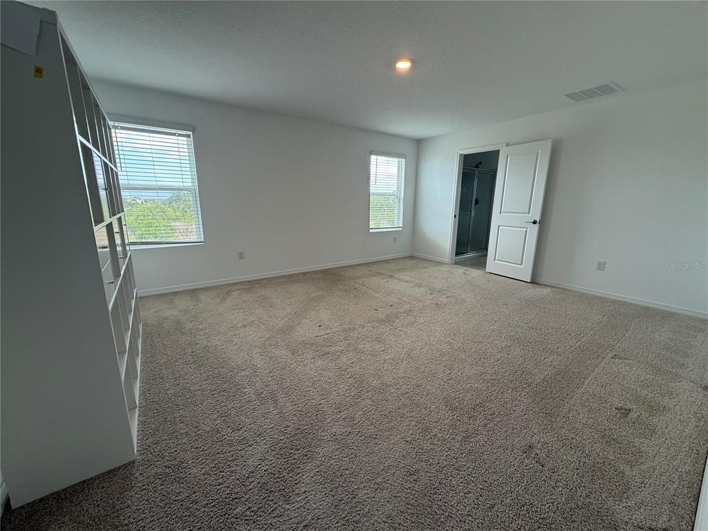 6431 Milestone Loop Palmetto, FL 34221 - Photo 10 of 28 a view of an empty room with window and closet area