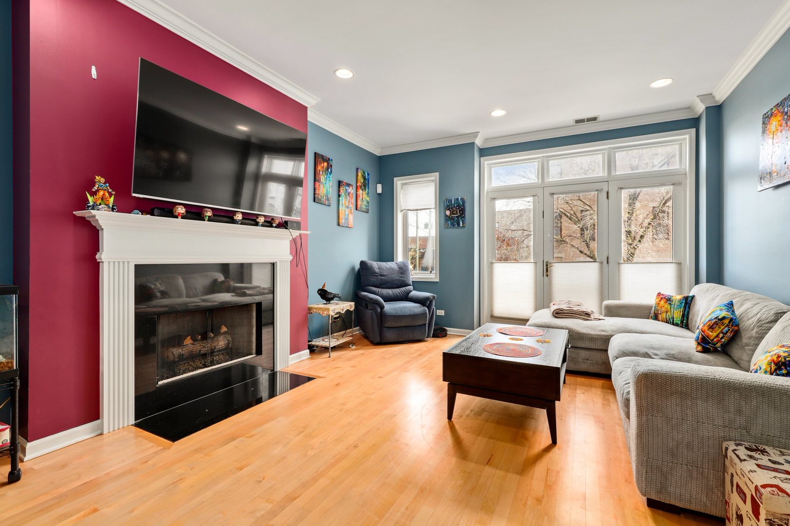 952 West Barry Avenue, Unit 1 Chicago, IL 60657 - Photo 2 of 11 a living room with furniture a flat screen tv and a fireplace