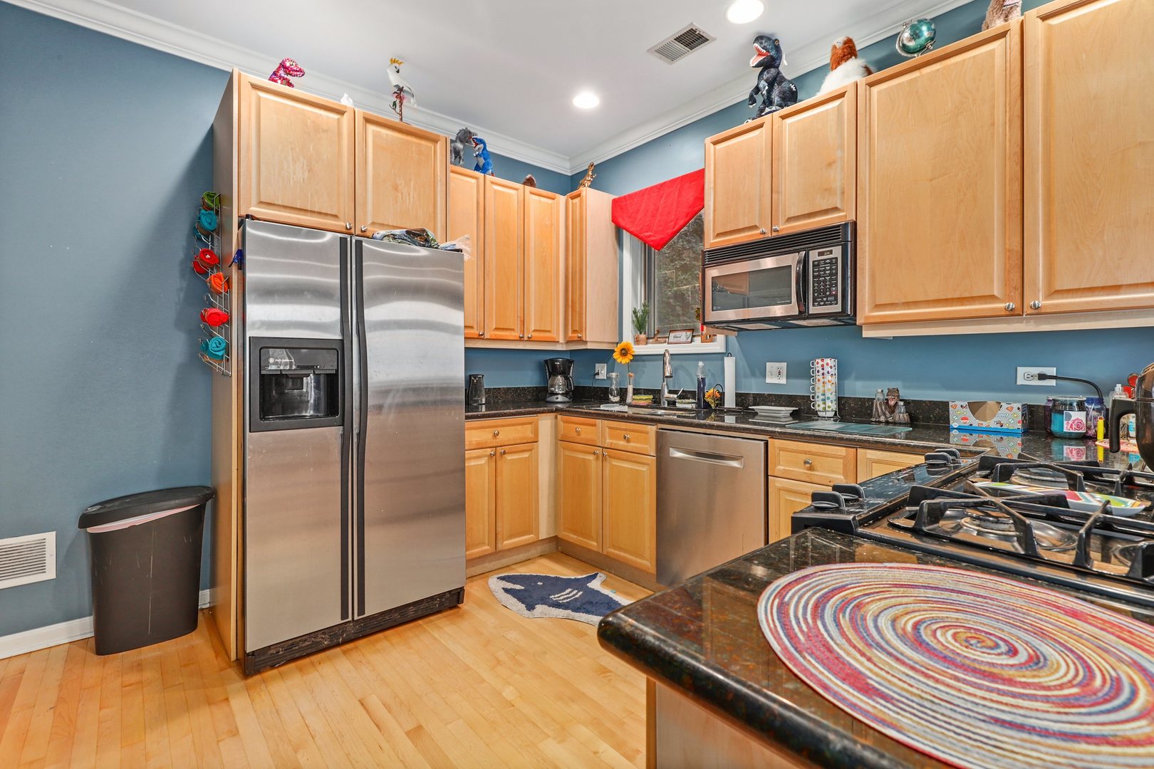 952 West Barry Avenue, Unit 1 Chicago, IL 60657 - Photo 4 of 11 a kitchen with stainless steel appliances granite countertop a refrigerator a stove and a sink