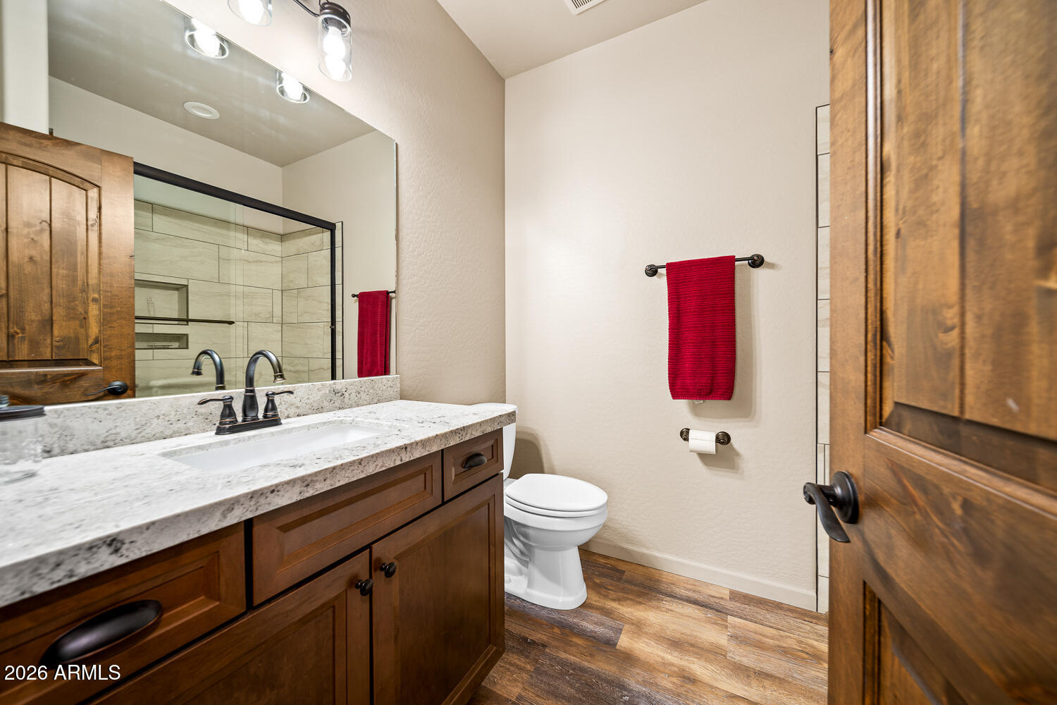 3160 North Eagle Landing Road Show Low, AZ 85901 - Photo 17 of 37 a bathroom with a sink vanity mirror and toilet