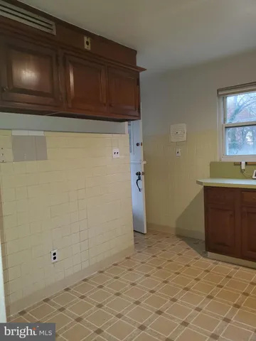 a kitchen with stainless steel appliances granite countertop a refrigerator sink and cabinets