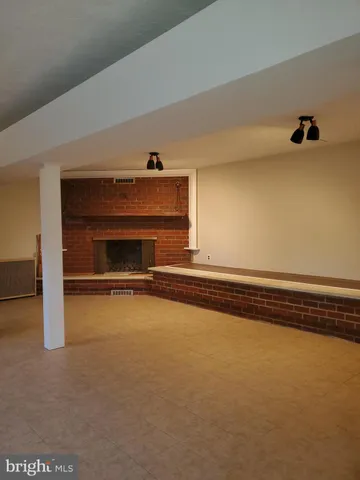 a view of an empty room with windows