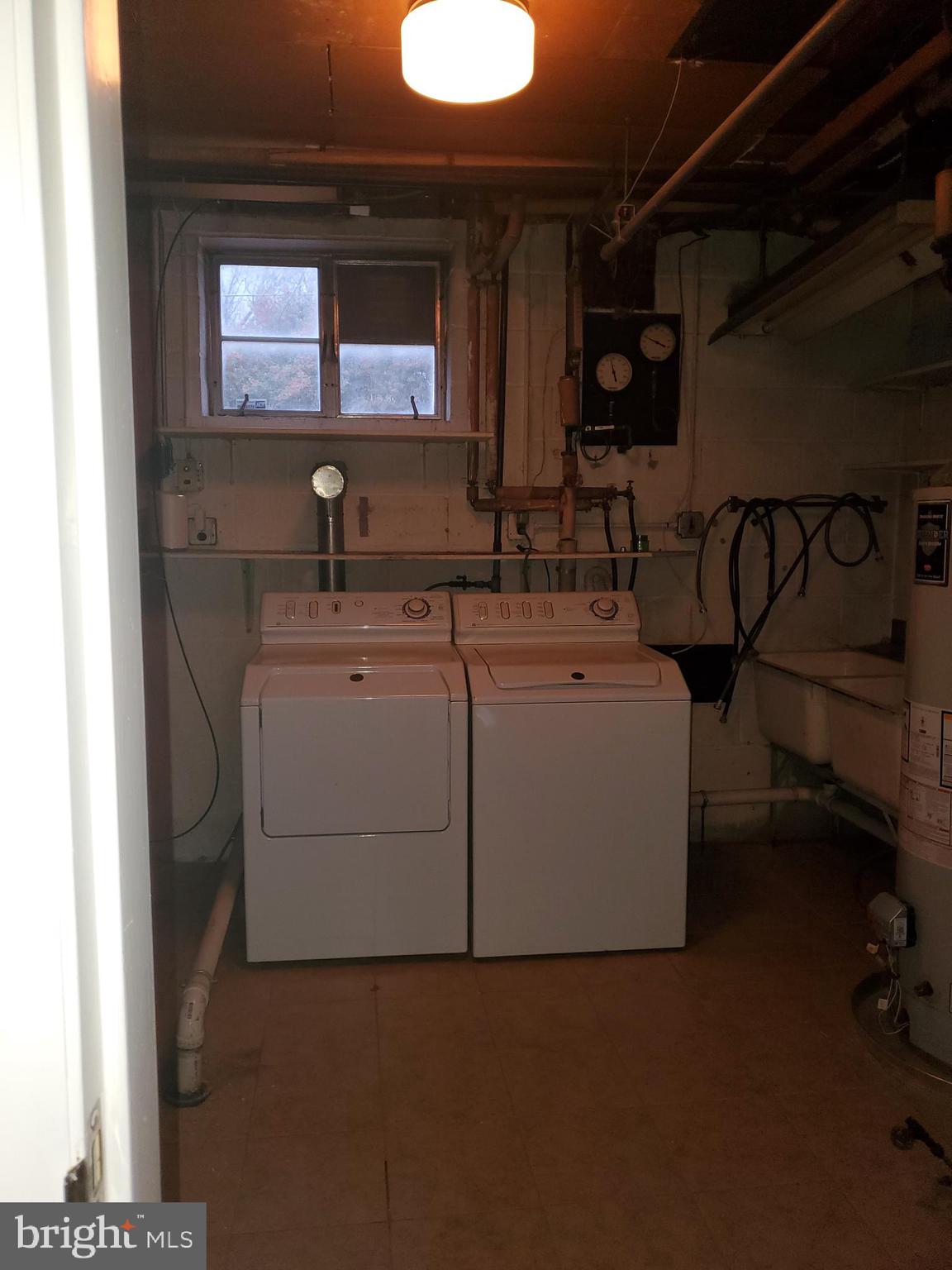 3311 Powder Mill Road Hyattsville, MD 20783 - Photo 31 of 33 a utility room with dryer and washer