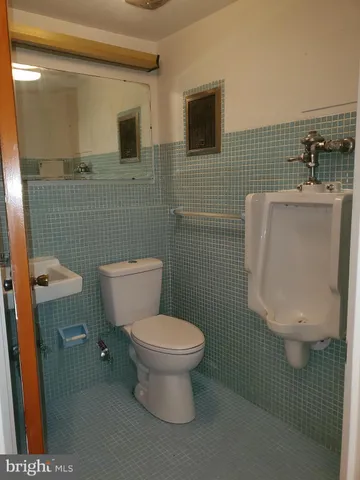 a bathroom with a blue tub