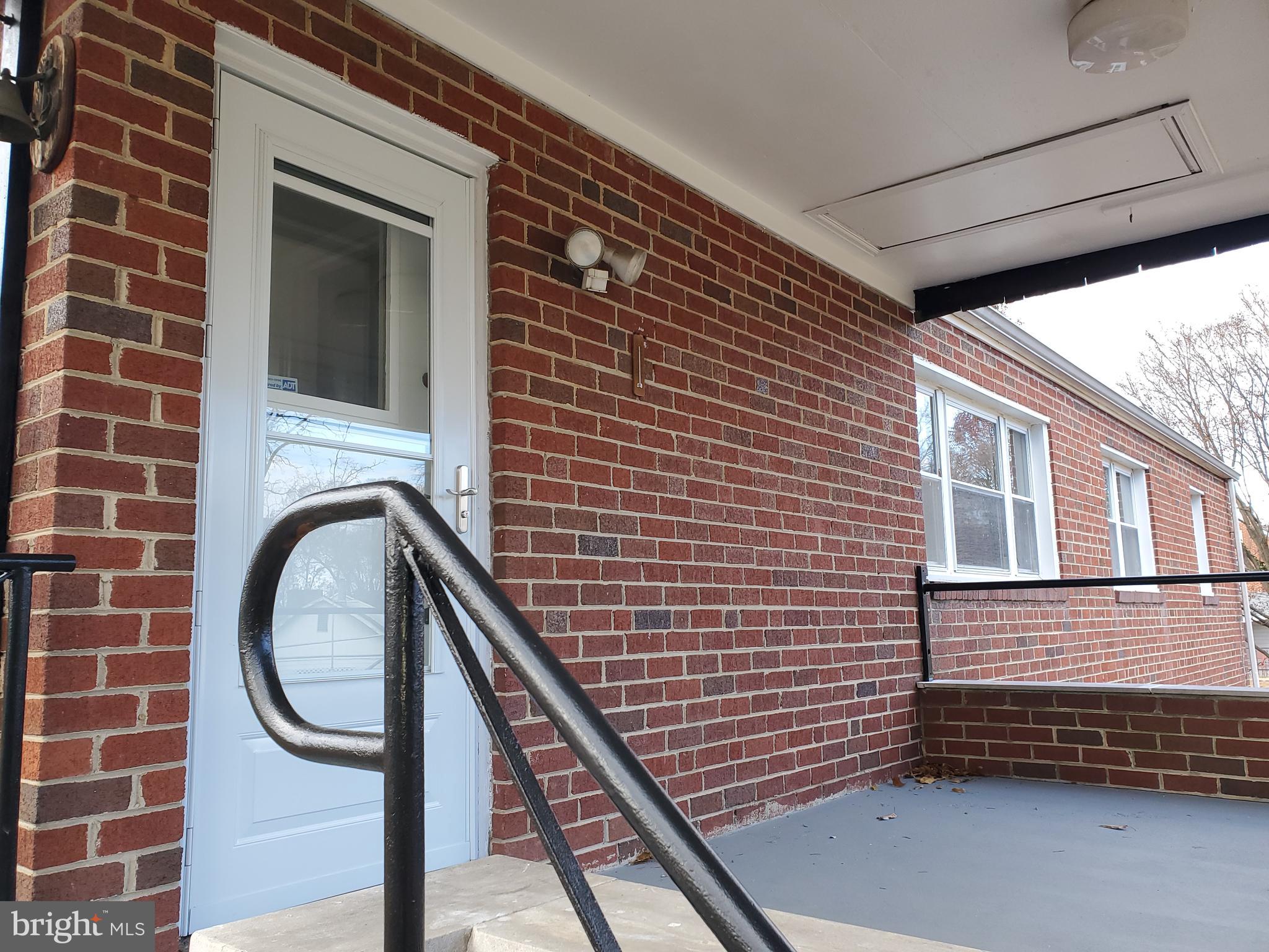 3311 Powder Mill Road Hyattsville, MD 20783 - Photo 5 of 33 a front view of a house with a garden