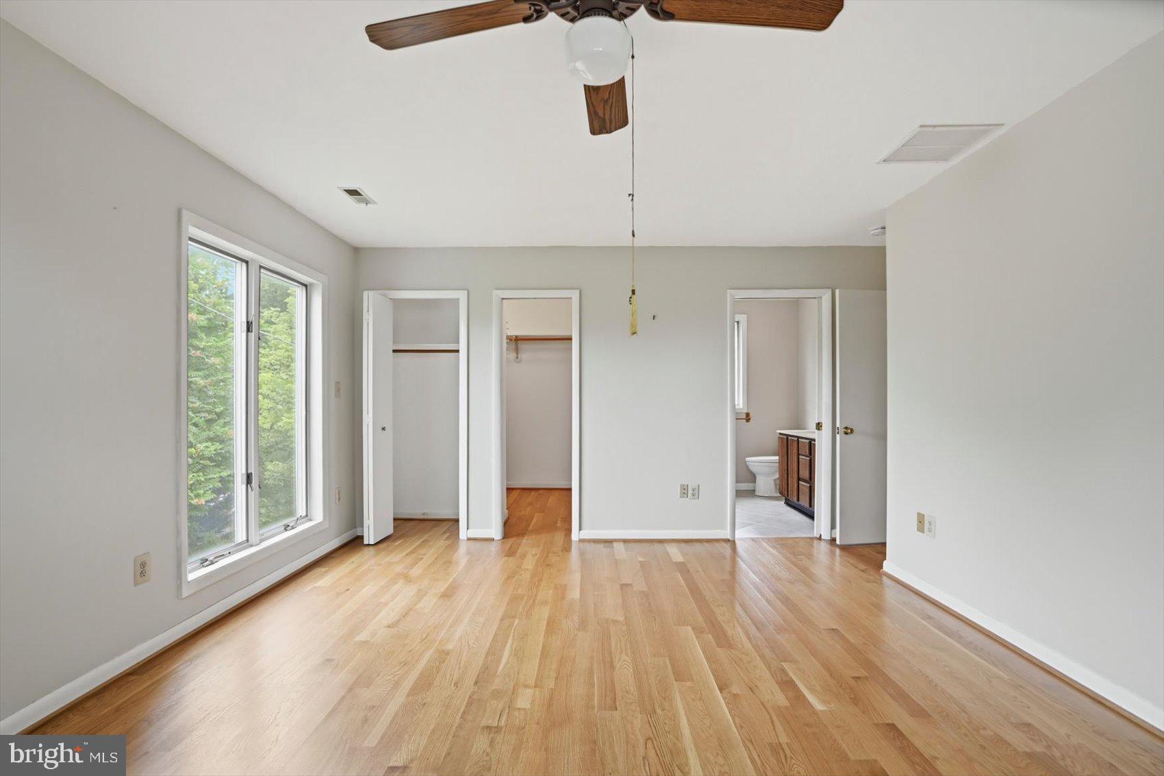 24 Normal Terrace Baltimore, MD 21286 - Photo 25 of 37 wooden floor in an empty room with a window