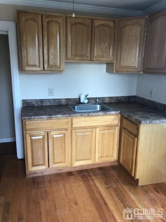 112 East Street Bound Brook, NJ 08805 - Photo 11 of 28 a kitchen with granite countertop white cabinets and a stove