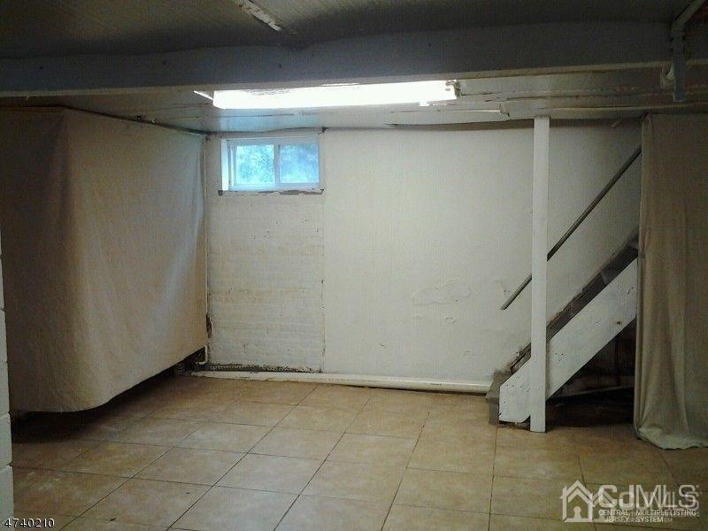 112 East Street Bound Brook, NJ 08805 - Photo 15 of 28 a view of an empty room with stairs