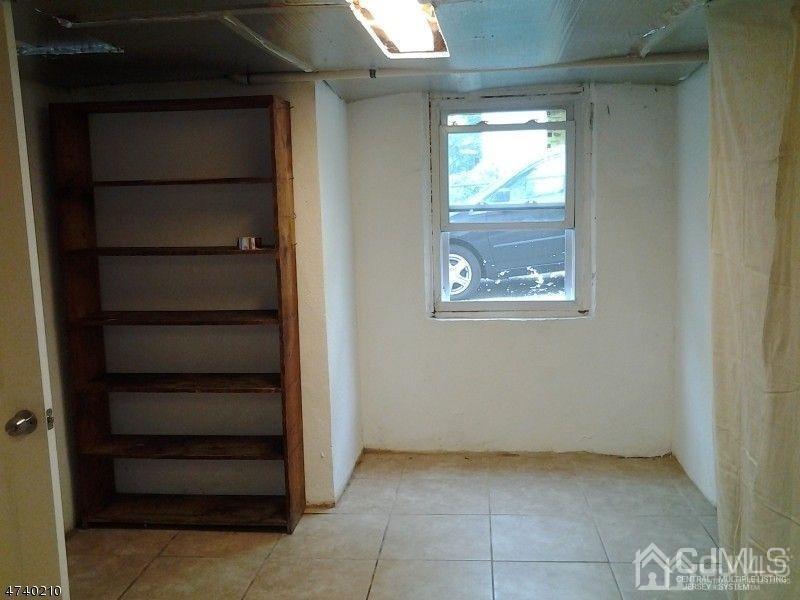112 East Street Bound Brook, NJ 08805 - Photo 16 of 28 a view of an empty room with a window