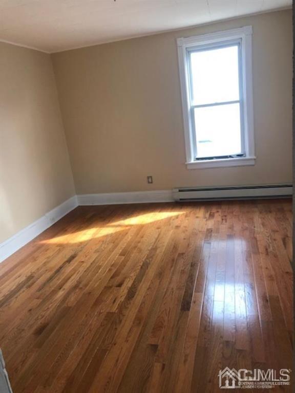 112 East Street Bound Brook, NJ 08805 - Photo 5 of 28 a view of an empty room and window