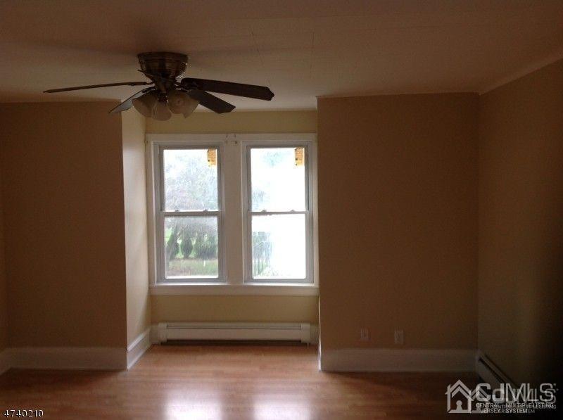 112 East Street Bound Brook, NJ 08805 - Photo 9 of 28 a view of an empty room and wooden floor