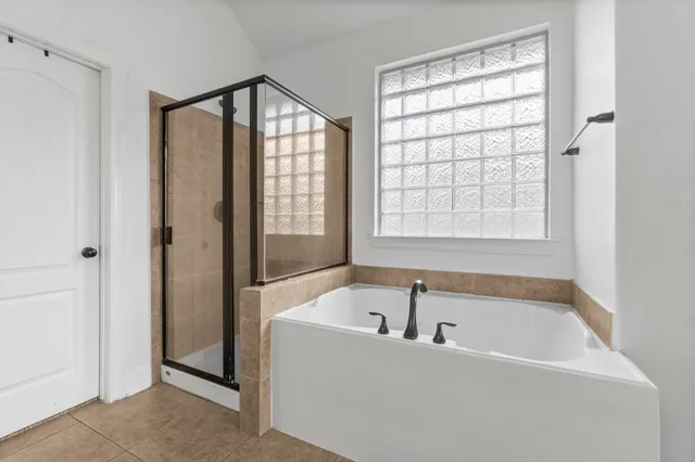 a white bath tub sitting next to a window
